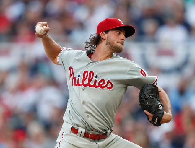 Philadelphia Phillies' starter Aaron Nola works in the first inning of Tuesday's game against the Braves. [John Bazemore / Associated Press]