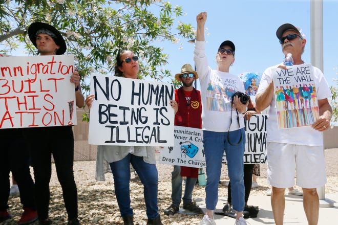 Protesters gather at the front of the Clint Border Patrol station to hear U.S. lawmakers, including Congresswoman Madeleine Dean, talk about what they thought of the area facilities they toured Monday, at the station. [Briana Sanchez / El Paso Times via AP]