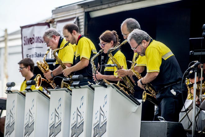 The saxophones take the spotlight as members of the Caterpillar Employees Big Band perform Thursday, June 27, 2019 at Heritage Days in Princeville. [DAVID ZALAZNIK/JOURNAL STAR]