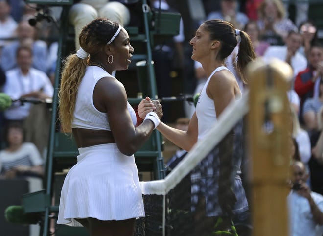 United States' Serena Williams greets Italy's Giulia Gatto-Monticone at the net after winning their Women's singles match during day two of the Wimbledon Tennis Championships in London on Tuesday. [The Associated Press / Ben Curtis]