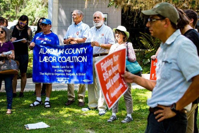 Members of Santa Fe College’s adjunct faculty and their supporters protest in support of unionization on May 21. [Gainesville Sun/ File]