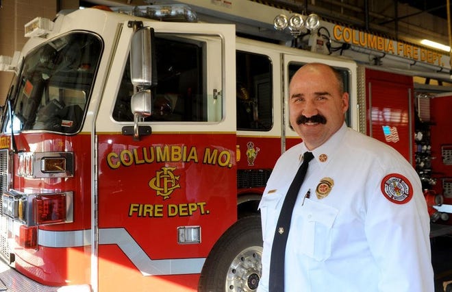 Columbia Fire Chief Randy White poses in front of a ladder truck in 2015. White has informed interim City Manager John Glascock that he will retire from the department effective Oct. 4. [Don Shrubshell/Tribune file photo]