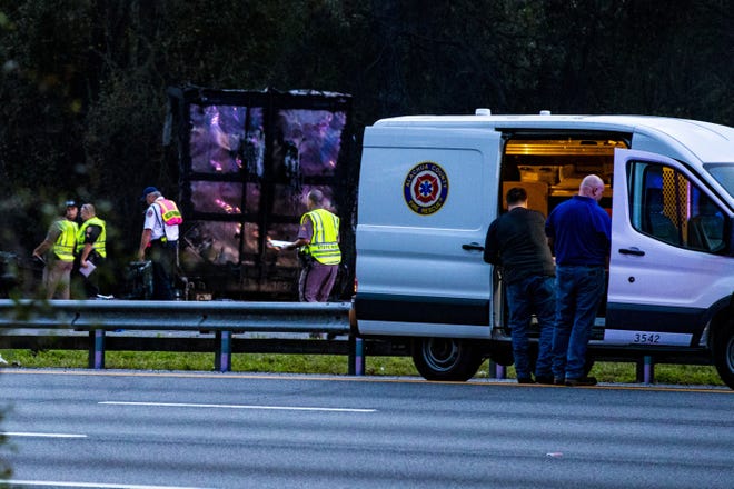 Police survey the scene after a wreck with multiple fatalities on Interstate 75, south of Alachua, near Gainesville, on Jan. 3. [Lauren Bacho/GateHouse Media]