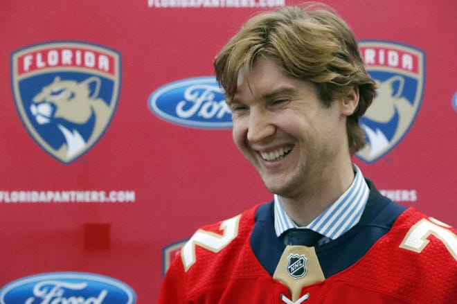 Florida Panthers new goaltender Sergei Bobrovsky laughs as he speaks during a news conference Tuesday in Sunrise. [AP Photo/Wilfredo Lee]