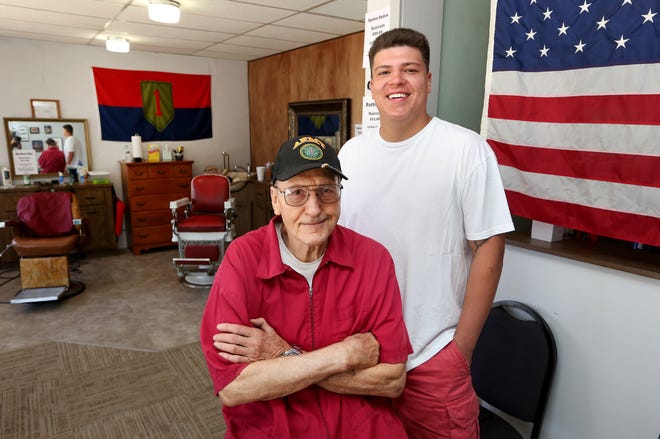 Army veteran Jim Mullins, left, and Kaden Flores have opened Veteran's Barber Shop at 804 East 4th Ave. [Sandra J. Milburn/HutchNews]