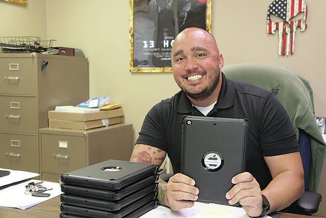 Police Chief Nick Silva is shown here in a photo taken Wednesday, June 26, when the Journal-Capital interviewed him about new computer equipment the Pawhuska Police Department had received to help officers more effectively provide assistance for persons possibly suffering from psychological ailments. Silva said Friday morning that interim city manager Larry Eulert and assistant city manager Rex Wikel came to the police department and dismissed him from his job. Robert Smith/Journal-Capital