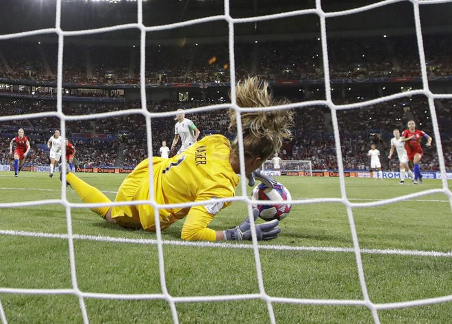 United States goalkeeper Alyssa Naeher saves a penalty shot taken by England's Steph Houghton during Tuesday's World Cup semifinal soccer match at the Stade de Lyon in France, Tuesday. The stop helped preserve the Americans' 2-1 victory. [Alessandra Tarantino/AP]