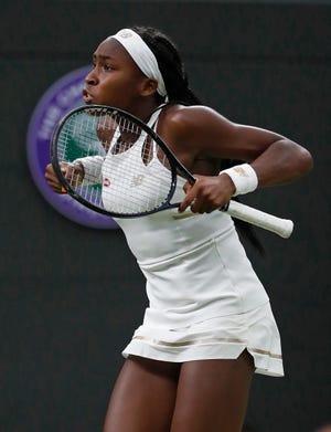 United States' Cori "Coco" Gauff celebrates after beating Slovakia's Magdalena Rybaikova in a women's singles match during Day 3 of the Wimbledon Tennis Championships in London Wednesday. [THE ASSOCIATED PRESS / ALASTAIR GRANT]