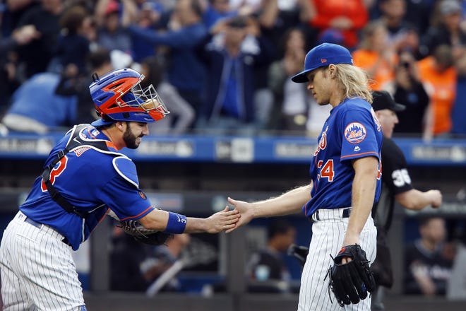 Mets' Noah Syndergaard, right, and catcher Tomas Nido. Syndergaard has reportedly requested that Nido be his personal catcher and the Mets gave the right-handed pitcher the green light. Syndergaard has a 2.29 ERA over 19 1/3 innings and three games throwing to Nido. [THE ASSOCIATED PRESS]