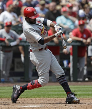 St. Louis Cardinals outfielder Dexter Fowler hits a two-run home run against the Seattle Mariners during the fourth inning of Thursday's game in Seattle. [AP Photo/Elaine Thompson]