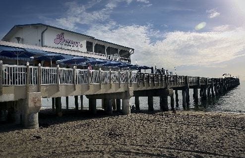 Benny's On The Beach is decorated with bamboo-covered posts and natural-finish seaside furnishings. [Daily News file photo]