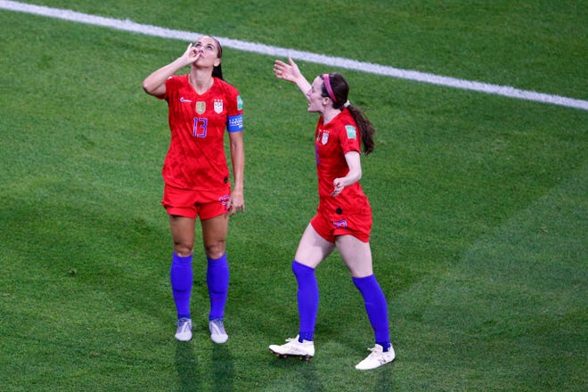 United States player Alex Morgan, left, celebrates her side's second goal during the Women's World Cup semifinal soccer match against England on Tuesday. [AP Photo/Francois Mori]