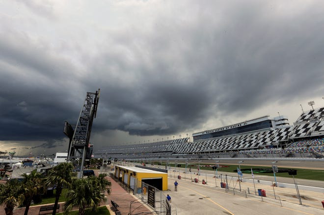 Storm clouds move over Daytona International Speedway causing a delay of events before a NASCAR Xfinity race Friday in Daytona Beach. The Coke Zero Sugar 400 is scheduled to start at 7:30 p.m. today. [John Raoux/The Associated Press]