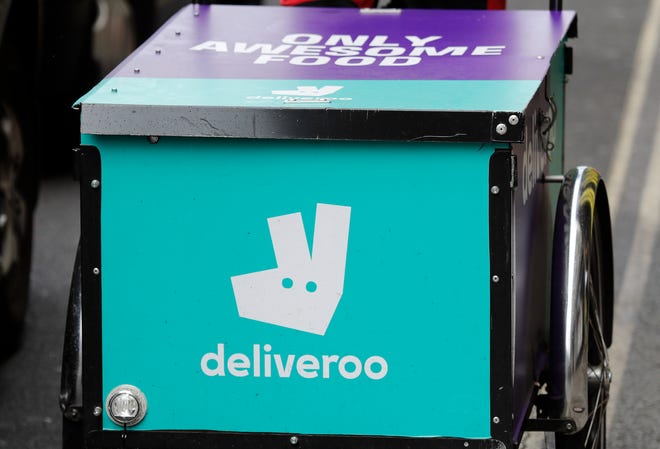 The U.K. competition watchdog has launched an investigation into Amazon’s purchase of a significant stake in food delivery service Deliveroo. [AP file photo]