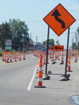 While the workers themselves had the Fourth of July off, the silent sentinels were still out on this section of roadway approaching the Marquette Avenue intersection. City Engineer Linda Basista, in providing a mid-season update to the Sault Ste. Marie City Commission, led those in attendance to believe that this specific shade of orange will continue to be visible well into the fall. (Scott Brand/The Sault News)