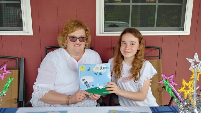 Isabella Jaeckel (right) did the illustrations for Janet White's children's book, "A Star Called Wink." They held a book signing at Rota Spring in Sterling on Saturday.

[Patricia Roy photo]