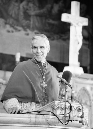 In this April 13, 1979 file photo, Bishop Fulton J. Sheen appears before parishioners on Good Friday at New York's St. Agnes Roman Catholic Church. Pope Francis has approved a miracle bringing the Sheen, the late American archbishop known for his revolutionary radio and TV preaching, closer to sainthood. The Vatican announced the move Saturday, July 6, 2019 which clears the way for beatification. [DAVE PICKOFF/THE ASSOCIATED PRESS]