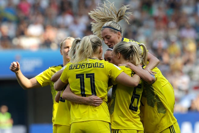 Sweden players celebrate after Kosovare Asllani scored her side's opening goal during the Women's World Cup third place match between England and Sweden at Stade de Nice on Saturday in Nice, France. [Claude Paris/The Associated Press]