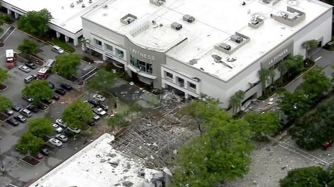 This image taken from video provided by WPLG shows debris covering the parking lot of a shopping center after an explosion on Saturday in Plantation, Fla. The explosion happened Saturday morning at the shopping center, we