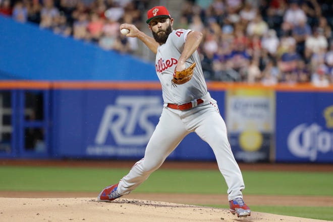 Phillies starter Jake Arrieta delivers a pitch during the first inning Saturday against the New York Mets in New York. [Frank Franklin II/AP]