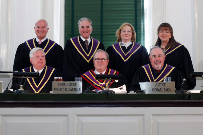 The Pennsylvania Supreme Court pose for photographs in 2011 at Philadelphia's historic Old City Hall. Justices from top left: Seamus P. McCaffery, Max Baer, Debra McCloskey Todd and Joan Orie Melvin. From lower left: Thomas G. Saylor, Chief Justice Ronald D. Castille and J. Michael Eakin. Ellwood City native Todd is being honored at a Sept. 16 dinner by the Ellwood City Area Historical Society. [GateHouse Media file]