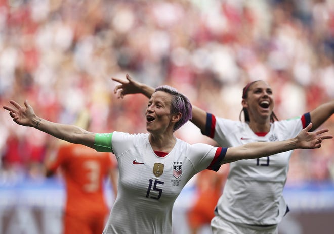 United States forwards Megan Rapinoe (left) and Alex Morgan celebrate the opening goal against the Netherlands in Saturday's Women's World Cup final. [AP Photo/Francisco Seco]