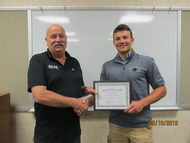 Knox County SWCD Chairman George Cummings presents the 2019 Max and Frances Sanford Memorial Scholarship to Case Hennenfent of Knoxville. [SUBMITTED PHOTO]