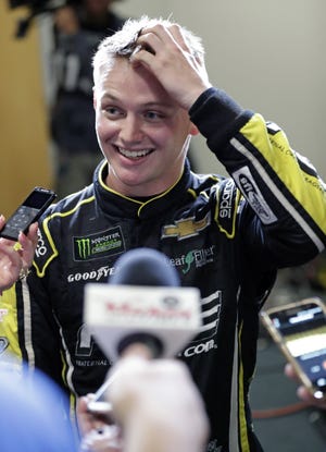 Justin Haley talks with reporters just before he was declared the winner of the NASCAR Cup Series at Daytona International Speedway on Sunday in Daytona Beach, Fla. [AP Photo/John Raoux]