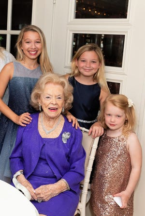 Elizabeth Bowden is surrounded by her grandchildren Avery, Reese and Sutton Rehl at her recent birthday party. [Photo by CAPEHART]