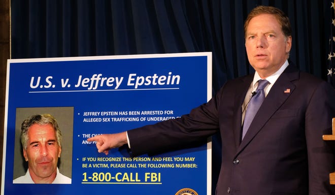 Geoffrey S. Berman, the U.S. attorney for the Southern District of New York, points to a picture of Jeffrey Epstein, who was arrested on Saturday, during a news conference Monday in Manhattan. “If you believe you are a victim of this man, Jeffrey Epstein, we want to hear from you,” Berman said. [Luiz C. Ribeiro/New York Daily News/TNS]