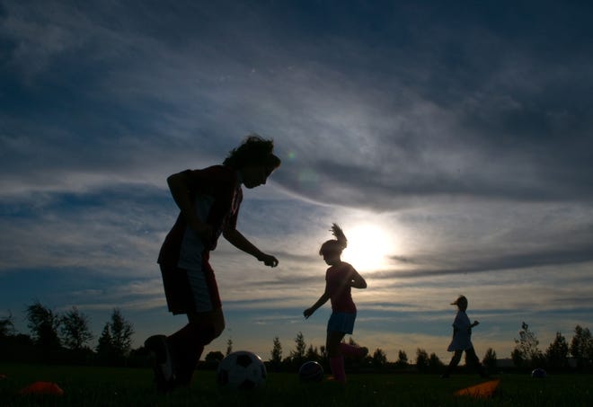 Members of the Pink Lightning girls U-9 Stockton Youth Soccer Association team practice at Garrigan Park in Stockton in 2008. The SYSA is awaiting another big summer of signups after the United States’ latest World Cup win, with about half of the 700 players in the fall leagues expected to be female. [CLIFFORD OTO/RECORD FILE 2008]