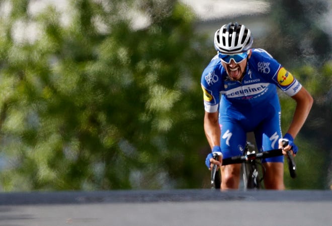 France's Julian Alaphilippe rides to the finish line to win Stage 3 of the Tour de France cycling race over 215 kilometers (133,6 miles). The stage started in Binche and finishing in Epernay, France on Monday. [THE ASSOCIATED PRESS / CHRISTOPHE ENA]
