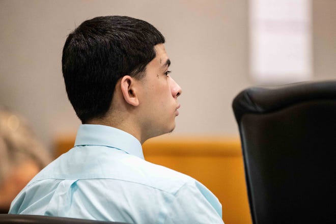 Jalen Veliz sits in a courtroom Tuesday on the first day of his capital murder trial. He is accused of fatally shooting a man during a drug deal gone wrong at a South Austin apartment complex last year. [LOLA GOMEZ / AMERICAN-STATESMAN]
