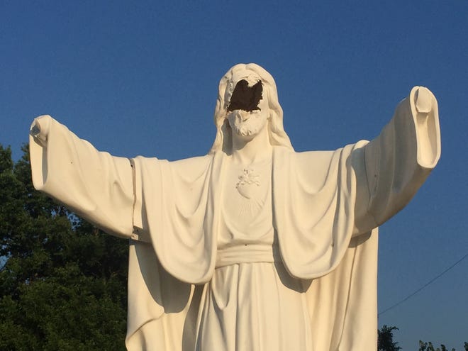 At Serenity Memorial Park in South Peoria, a statue of Jesus Christ has been severely vandalized. As shown in this photo from July 8, 2019, the hands were busted off and the face was bashed in. The $15,000 statue — which includes a plaque bearing the scripture, “Love one another as I have loved you” — might be irreparable. [PHIL LUCIANO/JOURNAL STAR]