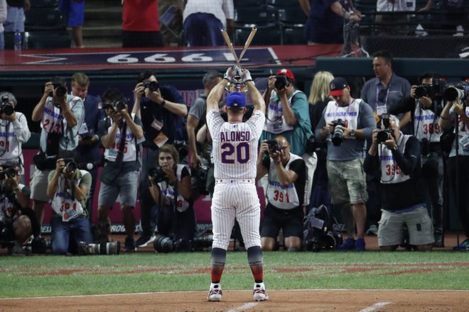 Pete Alonso, of the New York Mets, celebrates winning the Major League Baseball Home Run Derby, Monday in Cleveland. [RON SCHWANE/THE ASSOCIATED PRESS]