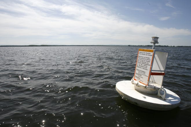 A floating marker indicates the border between the U.S. and Canada on Lake Champlain, in Vermont, as seen in June 2008. A new report from the U.S. Government Accountability Office says the Border Patrol, and the separate organization that provides surveillance from the air and along the waterways on the U.S. border with Canada, must do more to measure their effectiveness at securing the northern border between ports of entry. [AP photo/Toby Talbot, file]
