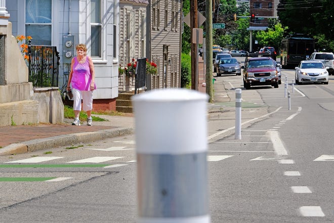 Sixty new bollards, shorter and more flexible than the ones posted last year, are now up in the painted buffer area of the bike lanes along Middle Street and the Lafayette Road corridor in Portsmouth. [Rich Beauchesne/Seacoastonline]