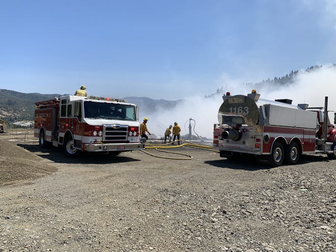 Douglas County Fire District No. 2 crews attend to the Roseburg landfill fire at 1:38 p.m. Sunday. [Douglas County Fire District No. 2]