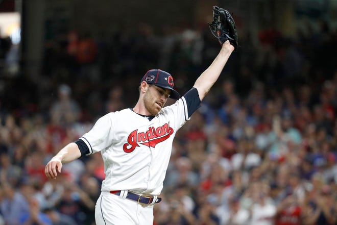 American League pitcher Shane Bieber, of Cleveland, reacts after striking out National League's Ronald Acuna Jr., of the Atlanta Braves, to end the top of the fifth inning of the MLB All-Star Game, Tuesday in Cleveland. [JOHN MINCHILLO/THE ASSOCIATED PRESS]