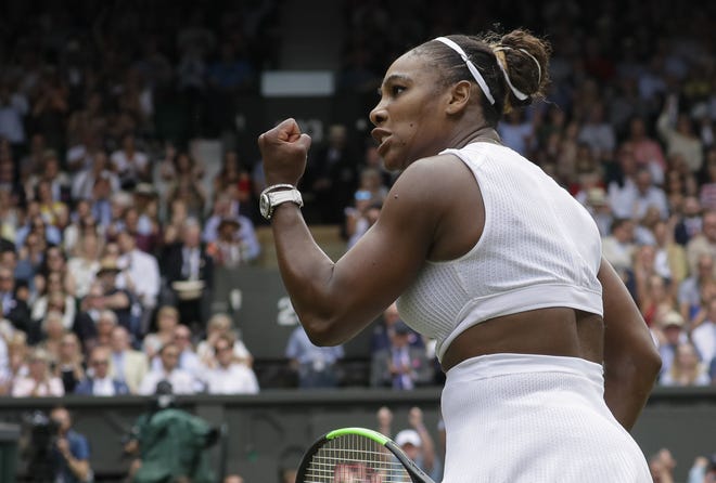 Serena Williams celebrates defeating fellow American Alison Riske during a quarterfinal match at the Wimbledon Tennis Championships on Tuesday in London. [KIRSTY WIGGLESWORTH/THE ASSOCIATED PRESS]