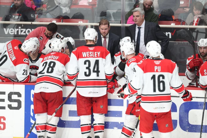Marshfield native Ryan Warsofsky, center, who helped lead the AHL’s Charlotte Checkers to a league championship as a first-year assistant last season, was named head coach of the Carolina Hurricanes’ top minor league affiliate on Wednesday.

Charlotte Checkers photo