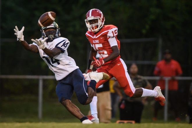 E.E. Smith wide receiver Jeremy Evans (14) has been one of the Golden Bulls' top senior leaders throughout the offseason. [Andrew Craft/The Fayetteville Observer]