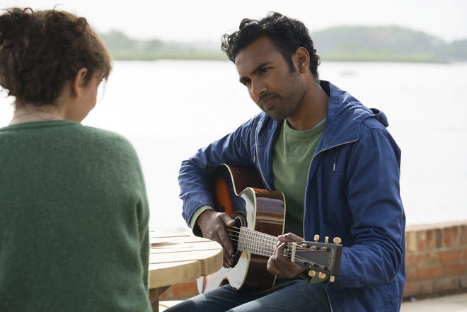 This image released by Universal Pictures shows Lily James,, left, and Himesh Patel in a scene from "Yesterday." (Jonathan Prime/Universal Pictures via AP)