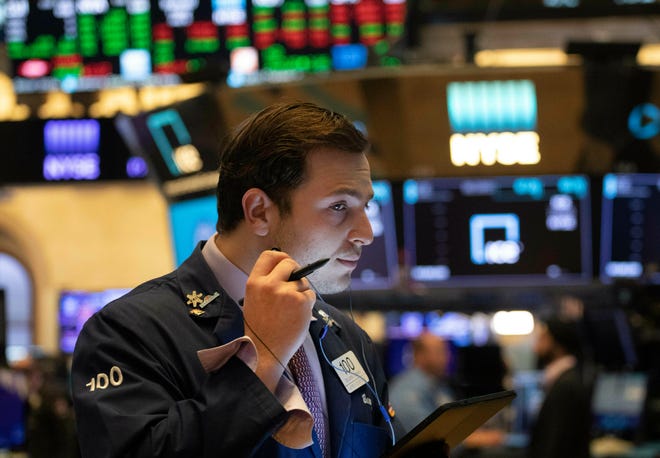 In this July 5, 2019, file photo trader Benjamin Tuchman works at the New York Stock Exchange in New York. (AP Photo/Mark Lennihan, File)