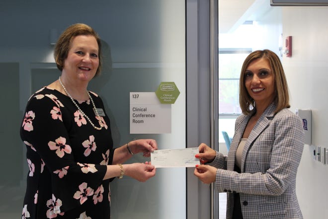 St. Anne’s Credit Union Senior Vice President of Human Resources Michelle Marcos presents Bristol Community College President Laura L. Douglas, Ph.D. with a check for $15,000 as part of St. Anne’s $50,000 pledge in support of the John J. Sbrega Health and Science Building Fund.