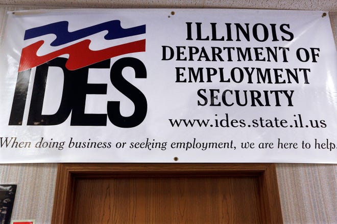 In this Thursday, Sept. 29, 2016 photo, an Illinois Department of Employment Security banner hangs in their office in Springfield. (AP Photo/Seth Perlman)