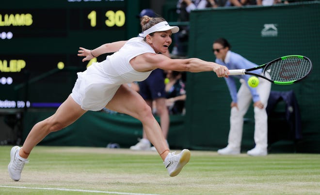 Romania's Simona Halep returns the ball to United States' Serena Williams during the women's singles final match on day twelve of the Wimbledon Tennis Championships in London, Saturday, July 13, 2019. (AP Photo/Ben Curtis)