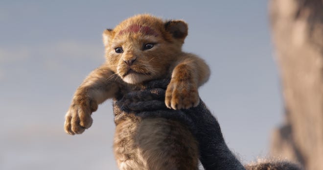 The lion Simba, voiced as a cub by JD McCrary, is rendered with cuddly verisimilitude in Disney's CGI remake of "The Lion King." [WALT DISNEY STUDIOS MOTION PICTURES]