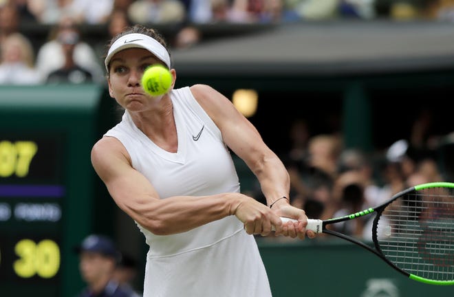 Romania's Simona Halep plays a return during her straight-set win over Serena Williams in the women's singles final at Wimbledon on Saturday. [AP Photo/Ben Curtis]