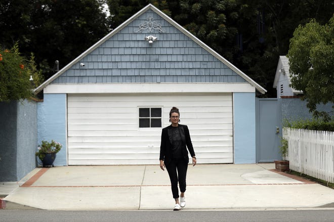 In this Wednesday, June 26, 2019, photo Hannah Moore poses for a portrait in Los Angeles. Moore has struggled to save since graduating from college in December 2007, the same month the Great Recession officially began. She has worked nearly continuously since then despite a couple of layoffs. (AP Photo/Marcio Jose Sanchez)
